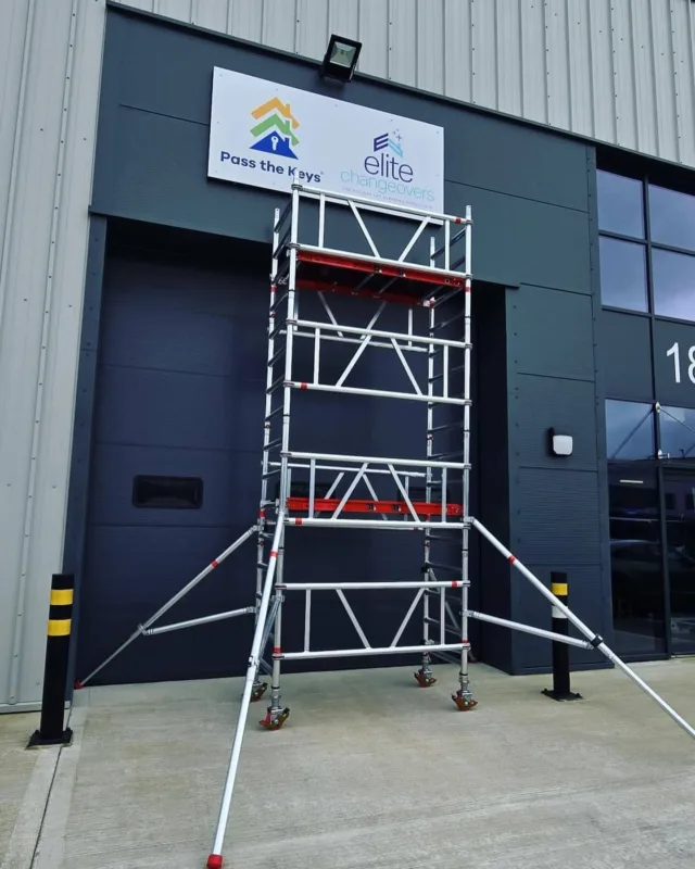 Exterior business signage installed for Pass the Keys and Elite Changeovers on an industrial unit